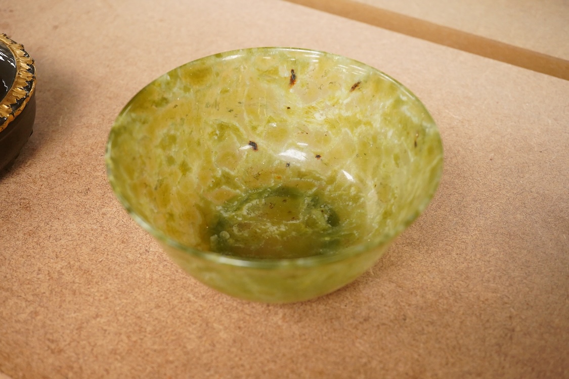 A Chinese bowenite jade bowl and a green quartz egg paperweight, 13cm